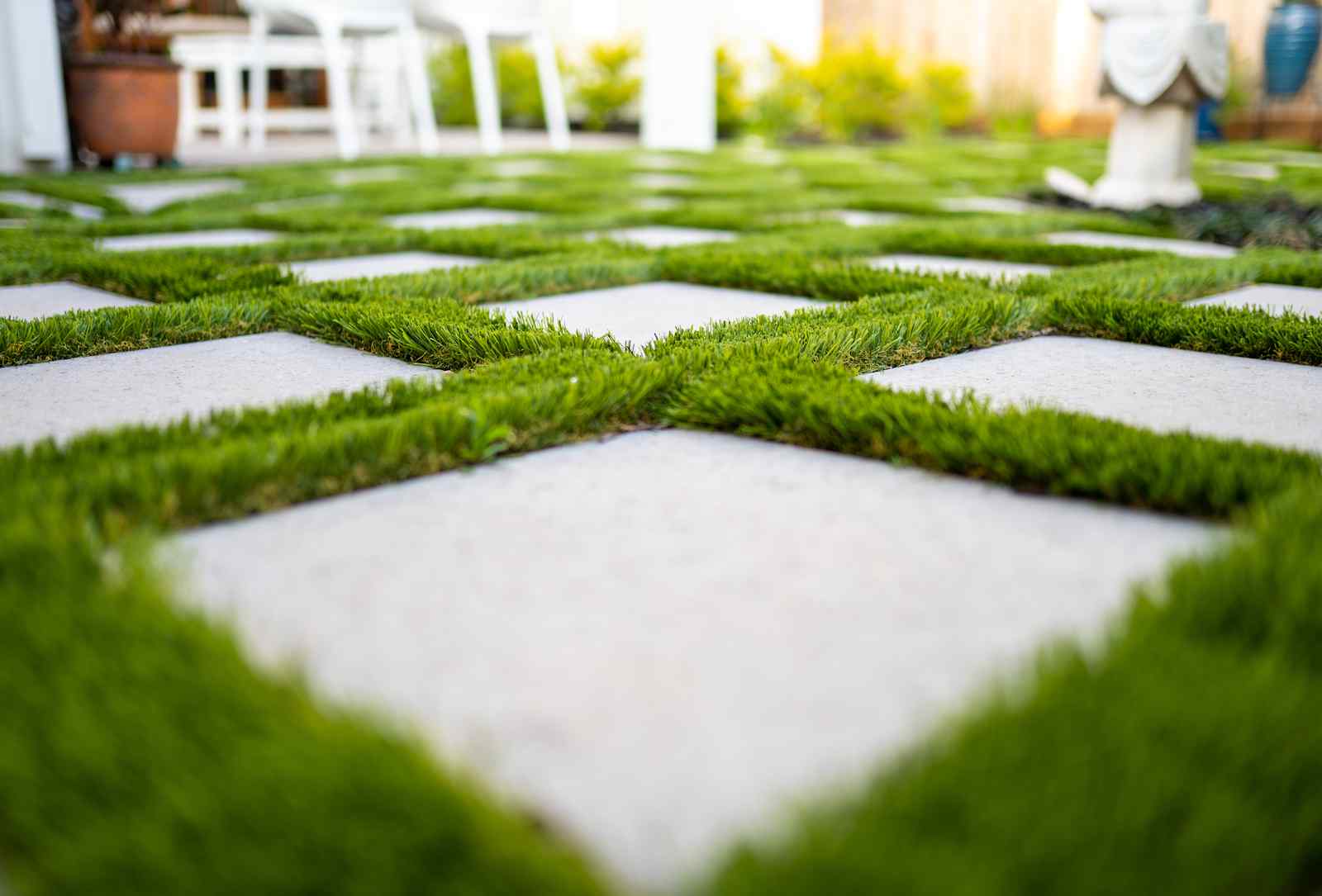 neatly installed concrete and artificial turf driveway in Scottsdale AZ